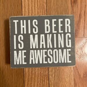 Small wooden sign “this beer is making me awesome”